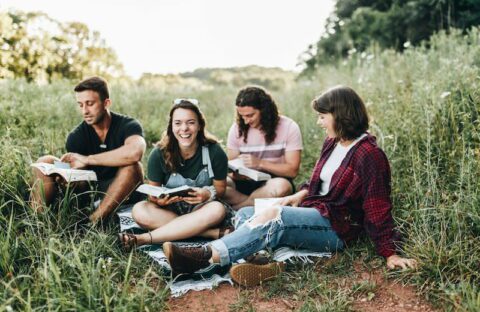 Members Of Ywam Lancaster'S Evening Bible Intensive Course Reading Together.