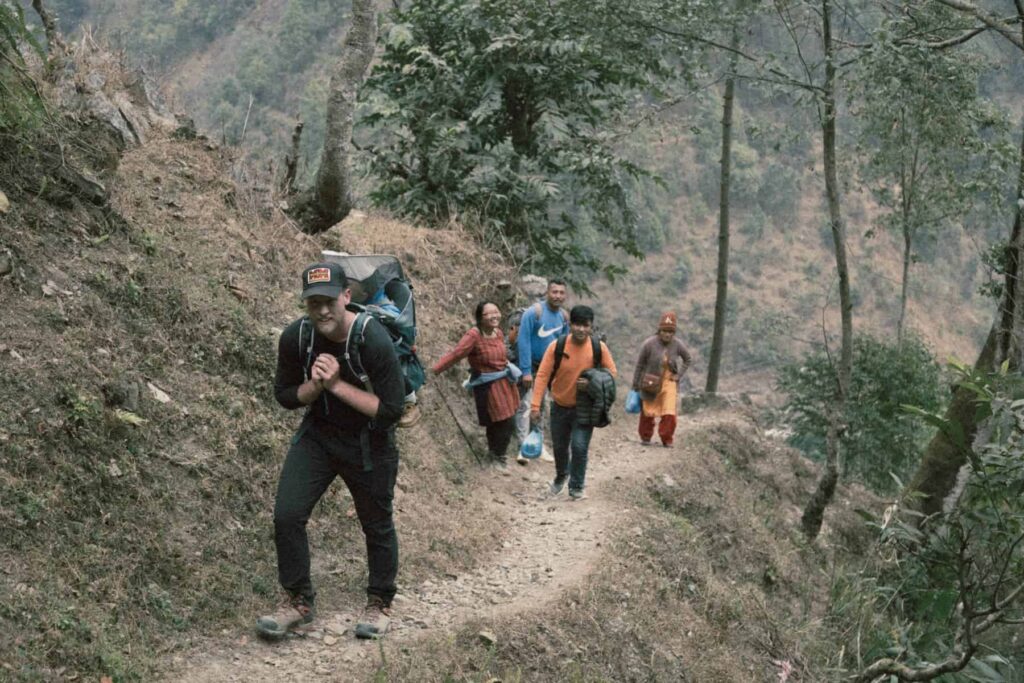 A Ytm Dts Member Hiking A Mountain With Locals That He Is Teaching The Word Of God To 55111 | Ywam Lancaster