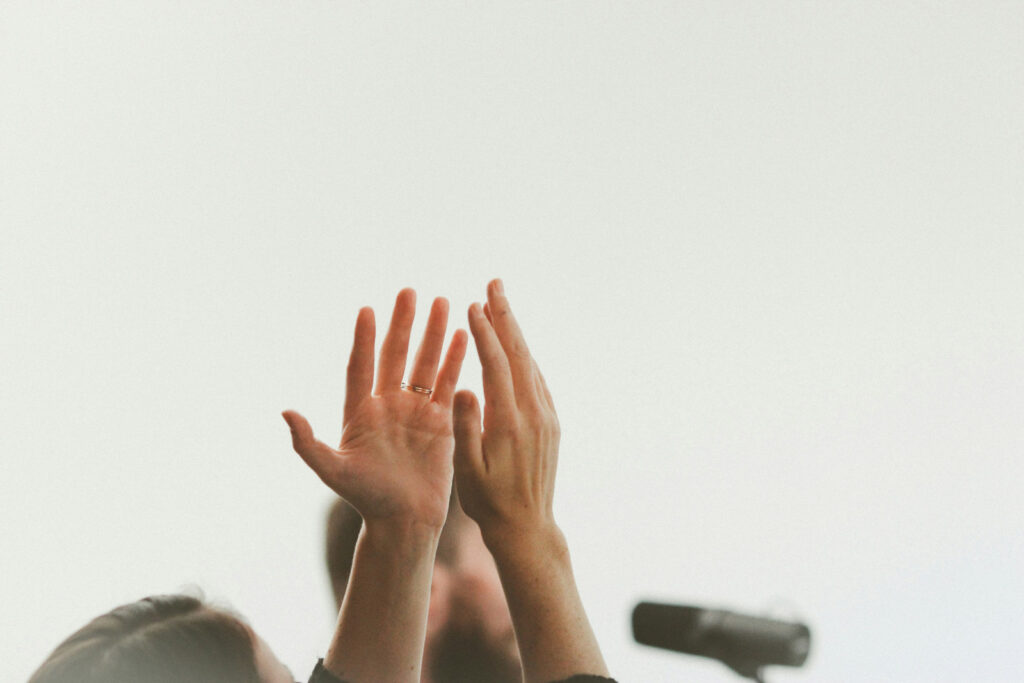 Hands lifted up in praise, presumably during a worship service while enrolled in Discipleship Training School 